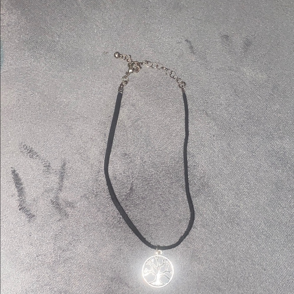 Elegant Silver and Black Necklace with Textured Pendant